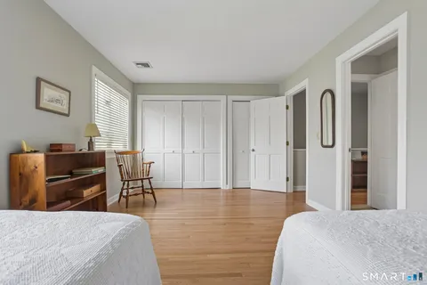 a bedroom with a bed and furniture