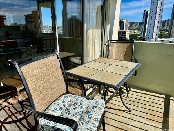 a view of a balcony dining area