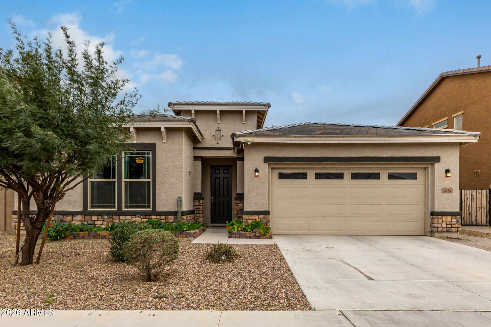 5347 West Lydia Lane Laveen, AZ 85339 - Photo 1 of 48 a front view of a house with garden