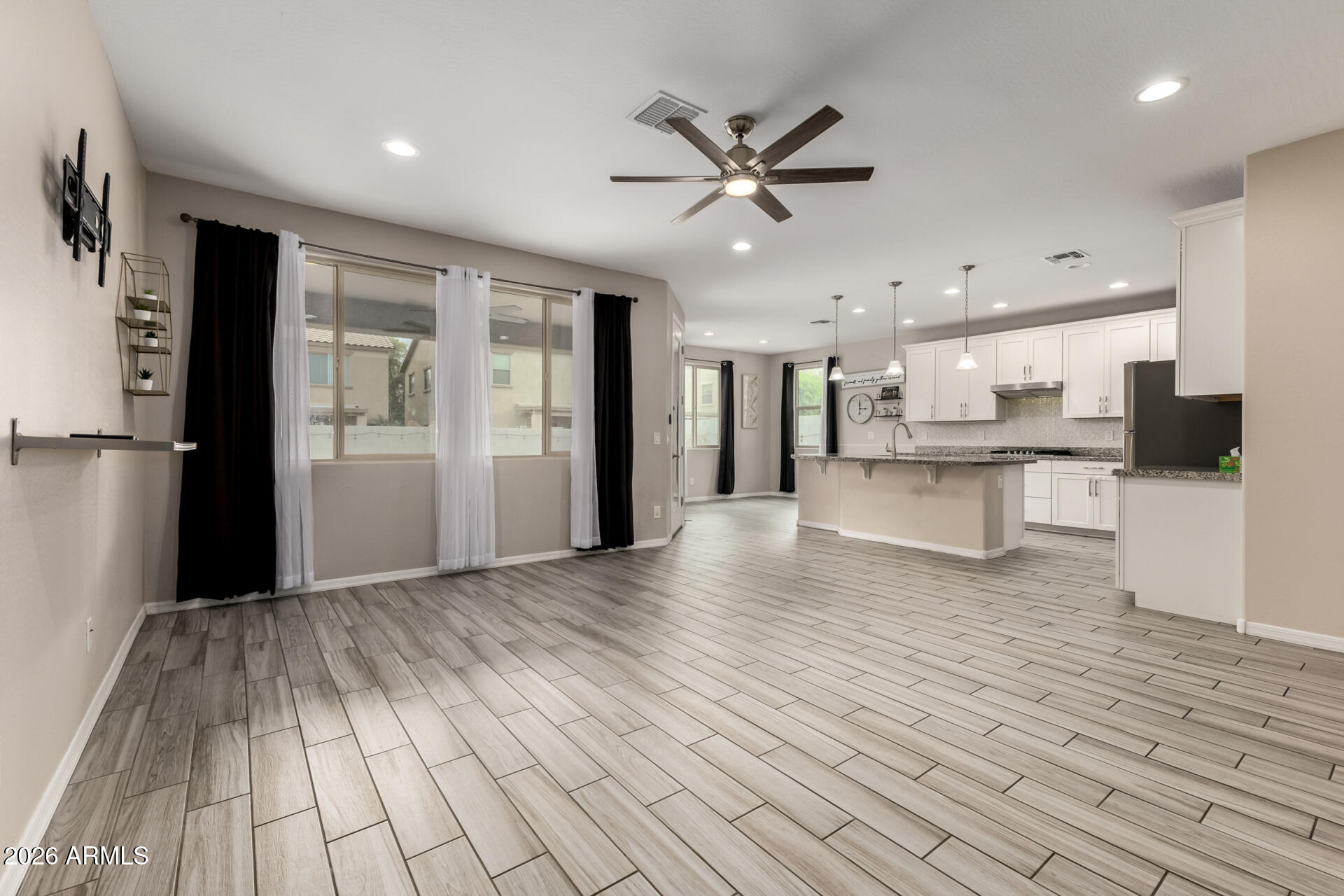 5347 West Lydia Lane Laveen, AZ 85339 - Photo 9 of 48 a view of a kitchen with wooden floor and a kitchen