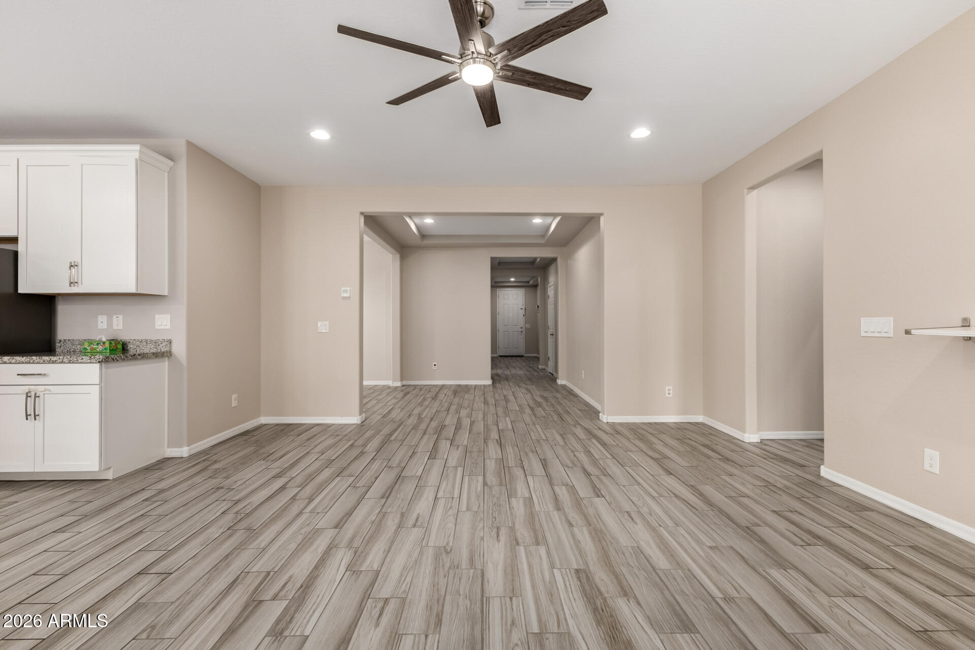 5347 West Lydia Lane Laveen, AZ 85339 - Photo 11 of 48 a view of empty room with wooden floor and fan