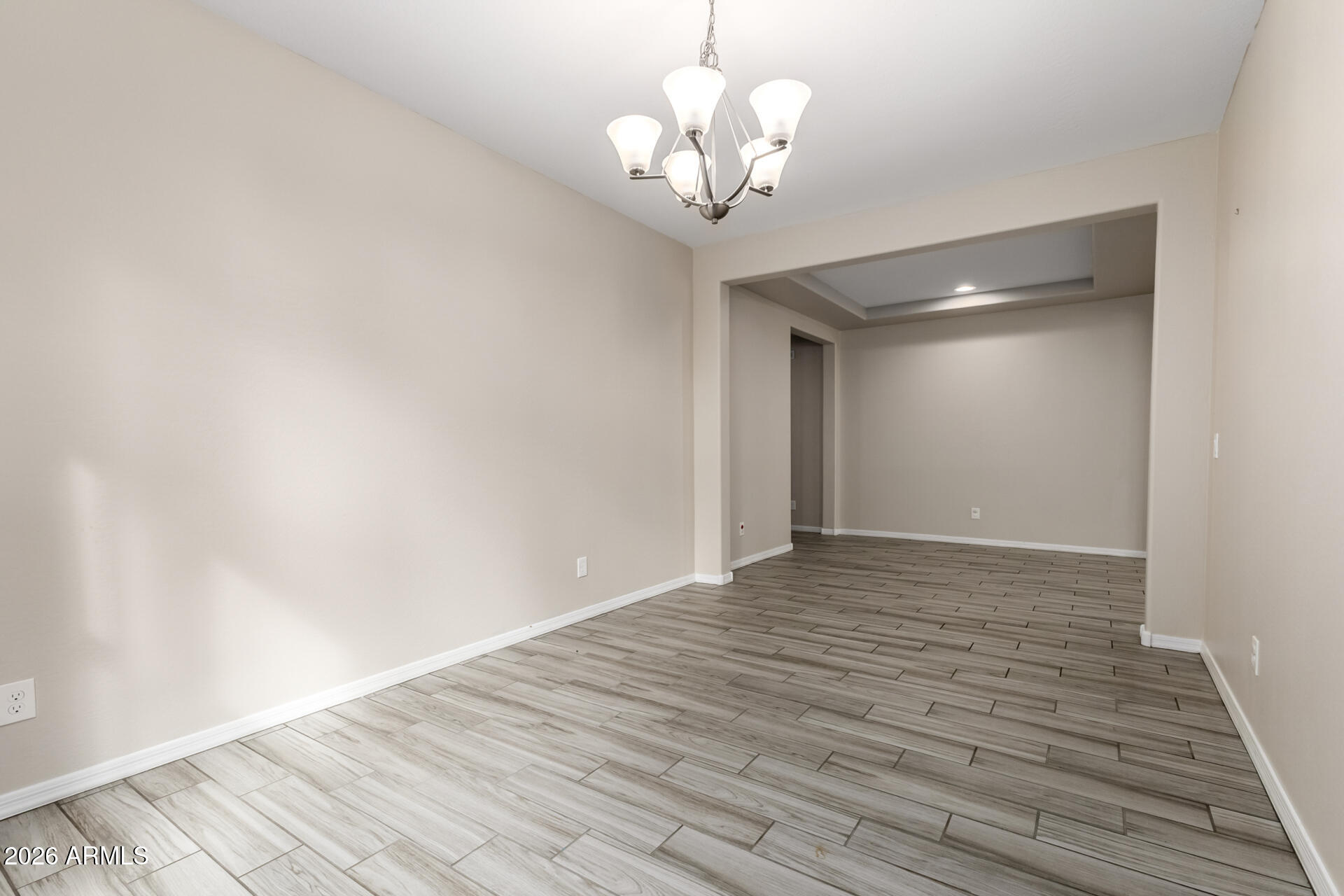 5347 West Lydia Lane Laveen, AZ 85339 - Photo 13 of 48 a view of empty room with wooden floor and fan