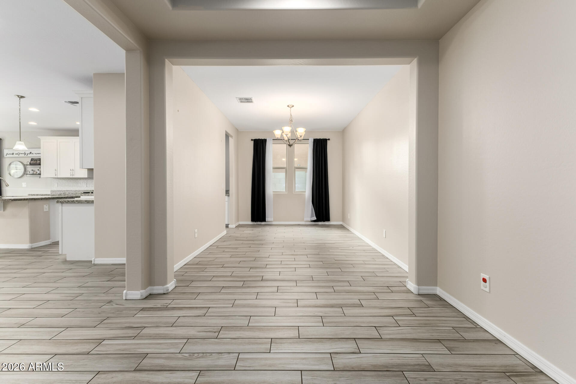 5347 West Lydia Lane Laveen, AZ 85339 - Photo 15 of 48 a view of a hallway with wooden floor