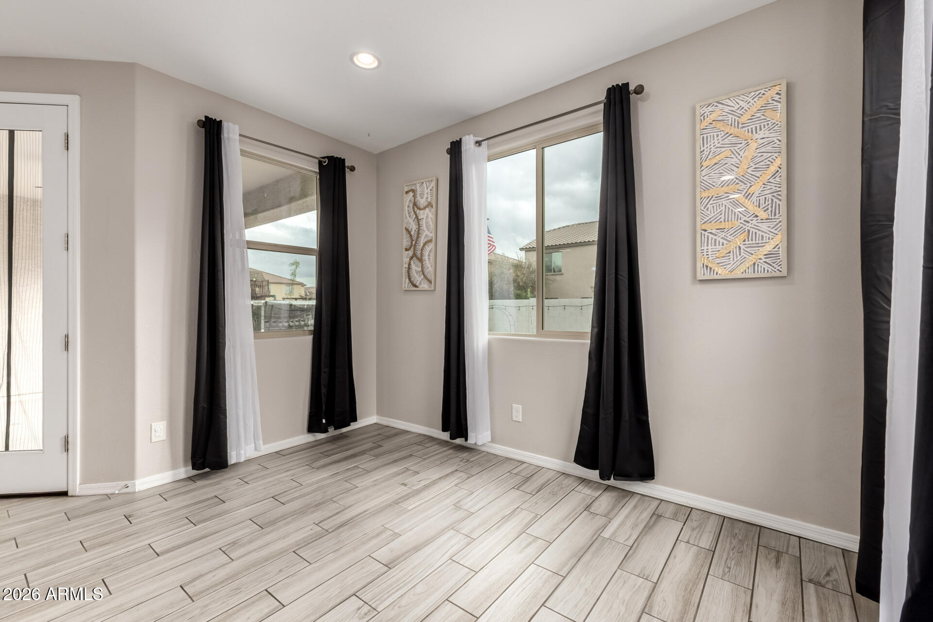 5347 West Lydia Lane Laveen, AZ 85339 - Photo 17 of 48 a view of a room with a window and wooden floor
