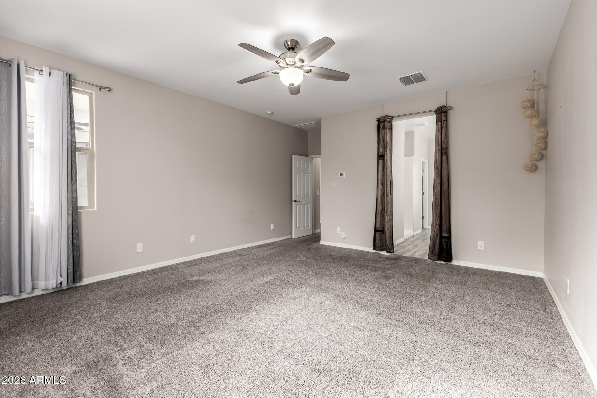 5347 West Lydia Lane Laveen, AZ 85339 - Photo 24 of 48 an empty room with closet and ceiling fan