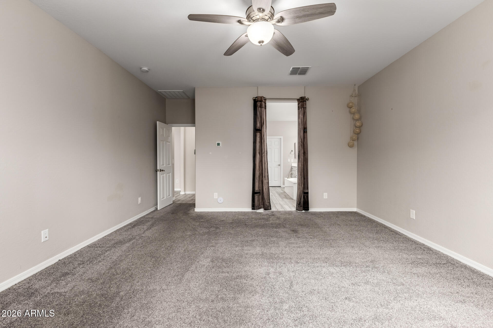 5347 West Lydia Lane Laveen, AZ 85339 - Photo 25 of 48 a view of an empty room with a fan