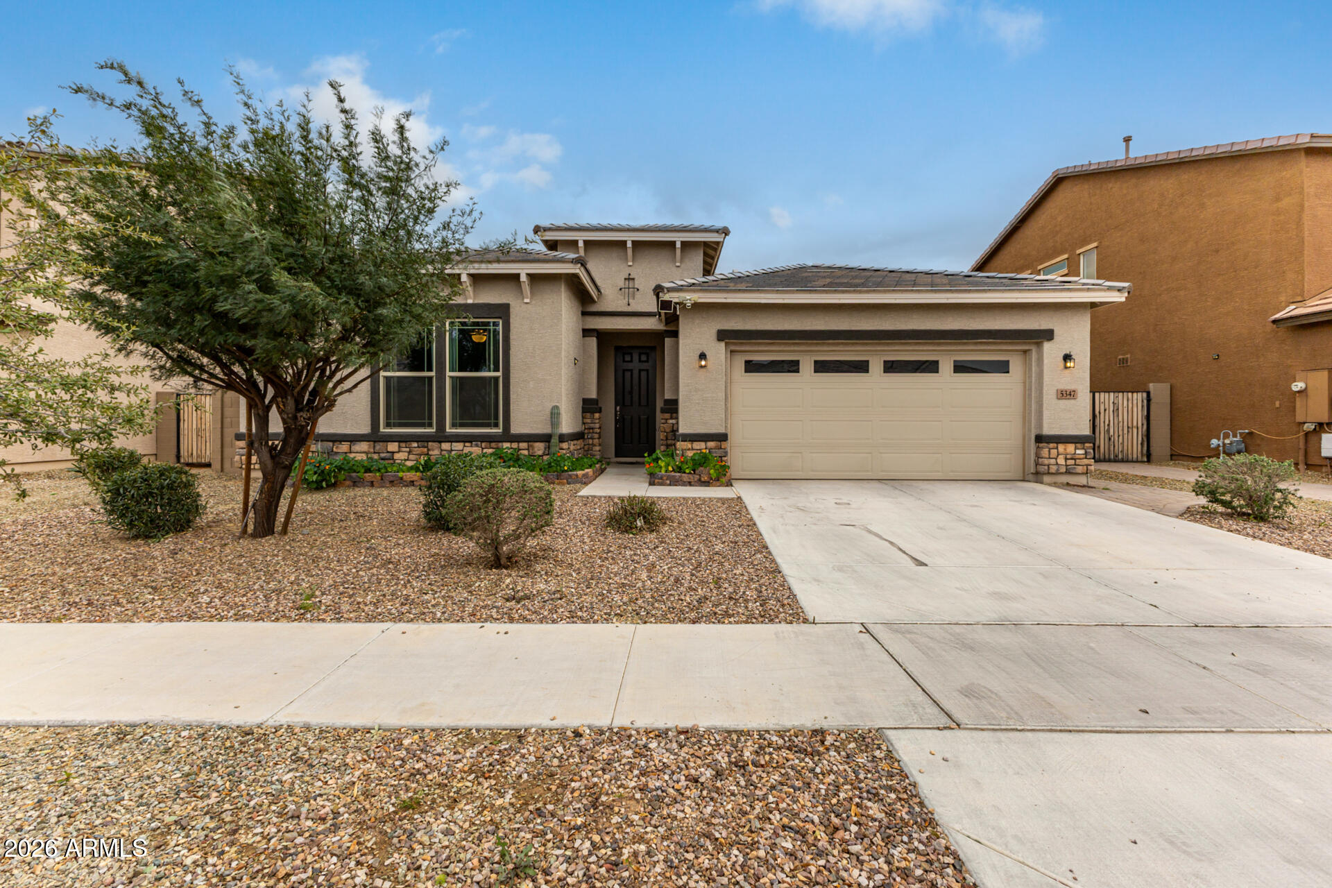 5347 West Lydia Lane Laveen, AZ 85339 - Photo 2 of 48 a view of a white house with a yard