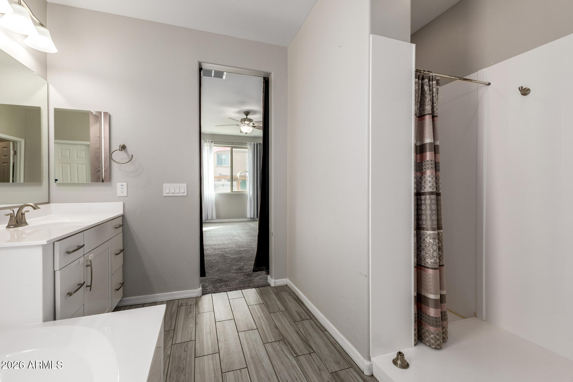 5347 West Lydia Lane Laveen, AZ 85339 - Photo 29 of 48 a bathroom with a sink and a mirror