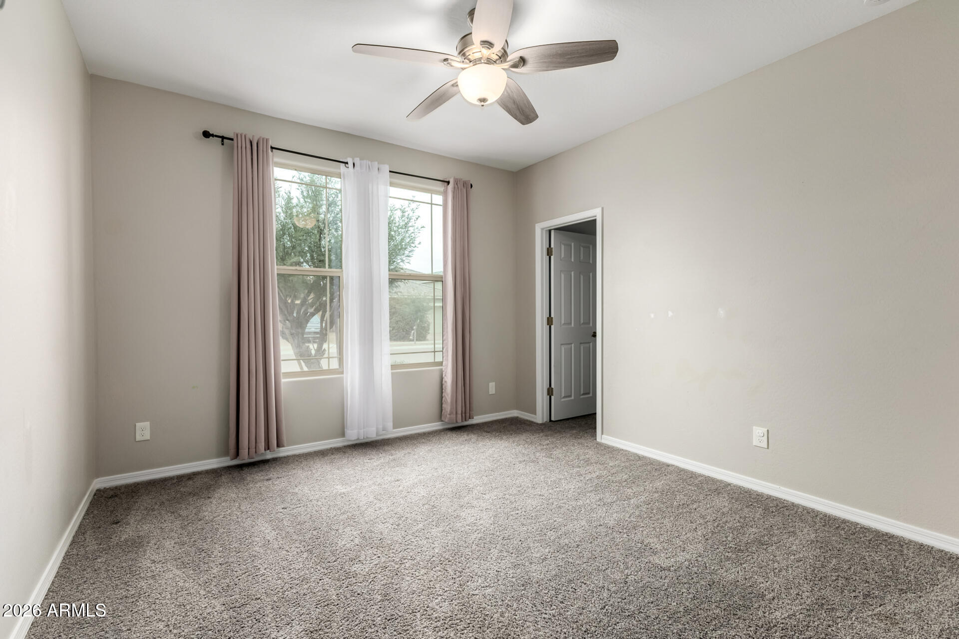 5347 West Lydia Lane Laveen, AZ 85339 - Photo 31 of 48 an empty room with windows and fan