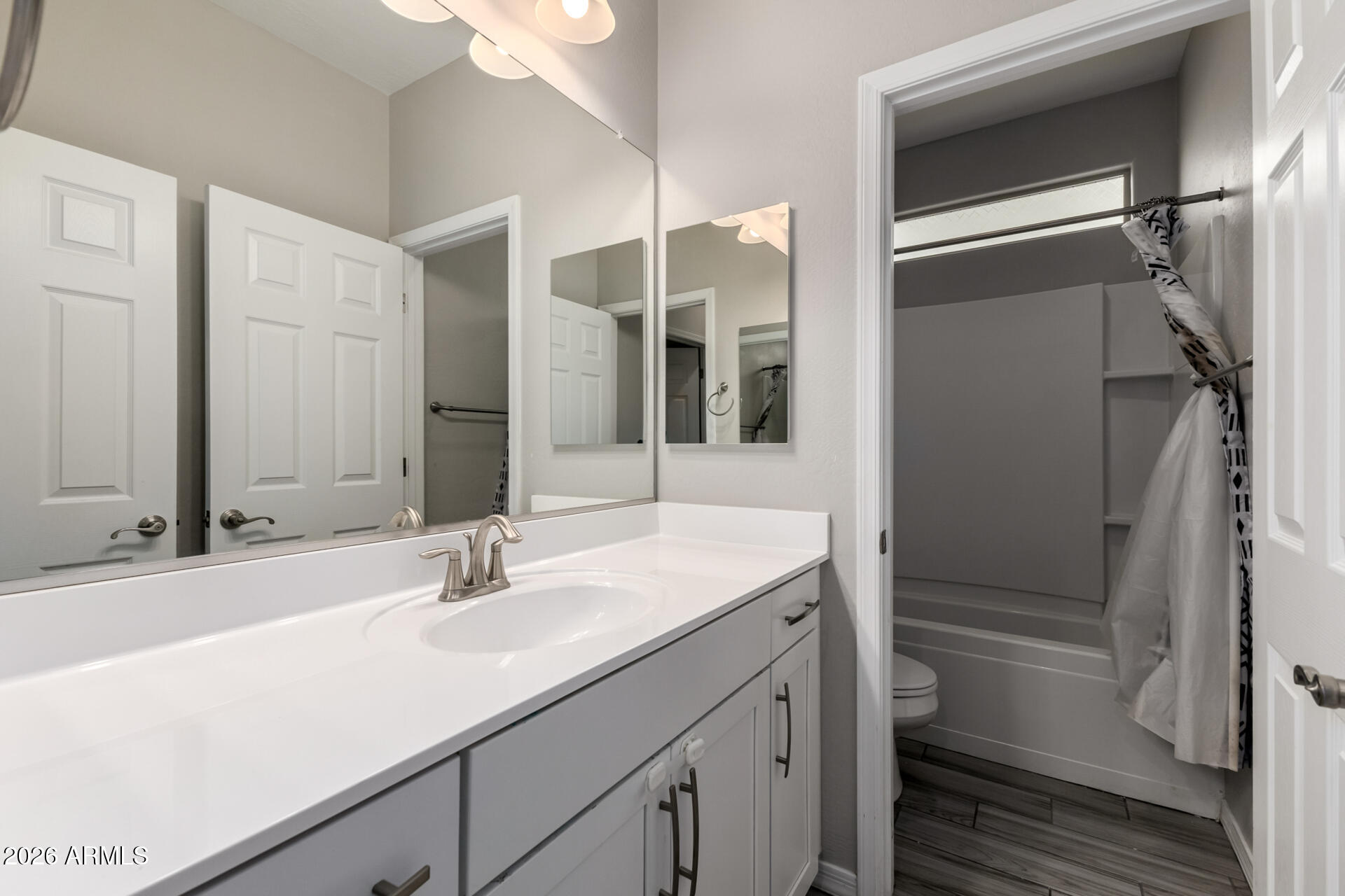 5347 West Lydia Lane Laveen, AZ 85339 - Photo 37 of 48 a bathroom with a sink and a mirror