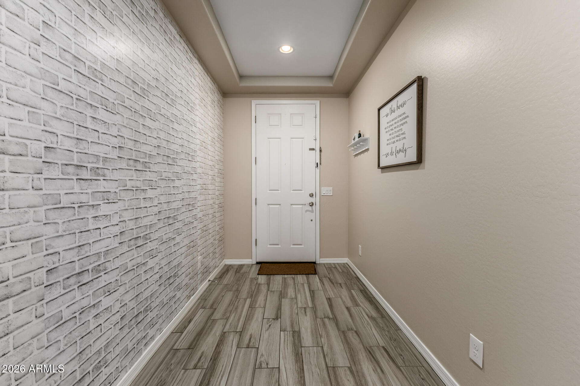 5347 West Lydia Lane Laveen, AZ 85339 - Photo 8 of 48 a view of a hallway with wooden floor
