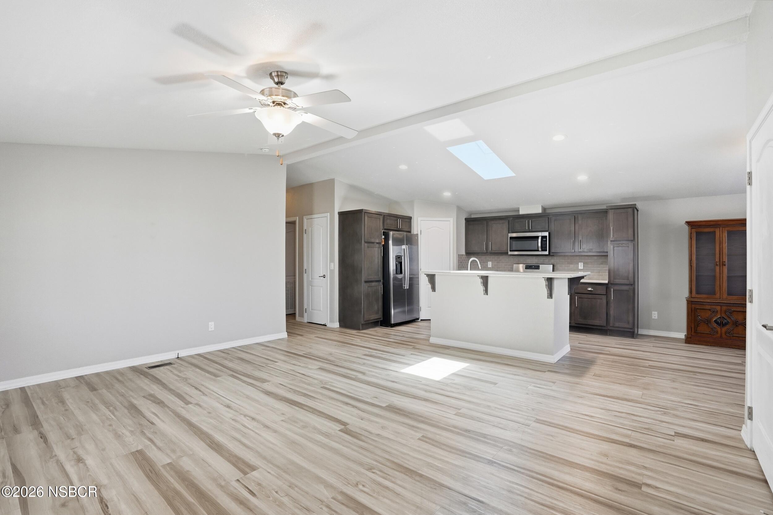 500 Atascadero Road, Unit M3 Morro Bay, CA 93442 - Photo 7 of 29 a view of a kitchen with a sink cabinets and wooden floor