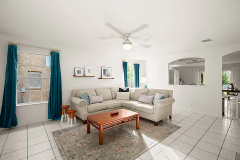 a spacious bedroom with a bed and a couch