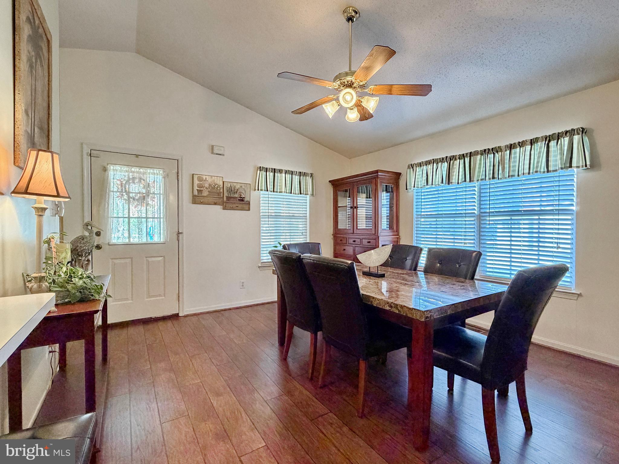 17466 Audrey Road Cobb Island, MD 20625 - Photo 19 of 59 a view of a dining room with furniture window and wooden floor