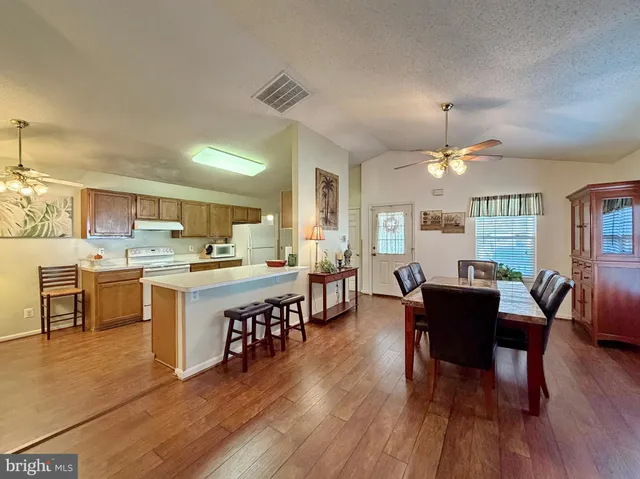 a kitchen with a stove a sink and a refrigerator