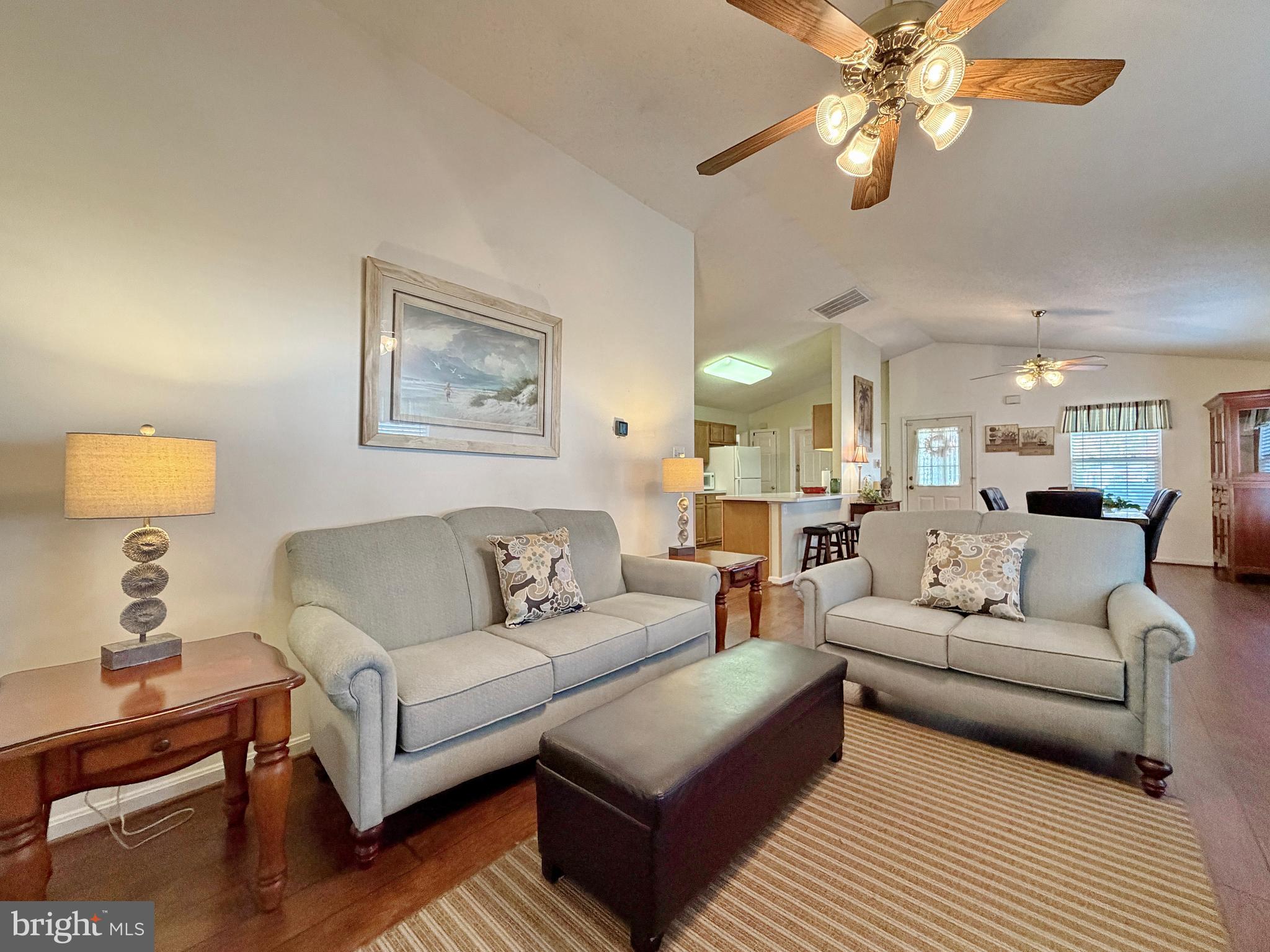 17466 Audrey Road Cobb Island, MD 20625 - Photo 31 of 59 a living room with furniture and a lamp