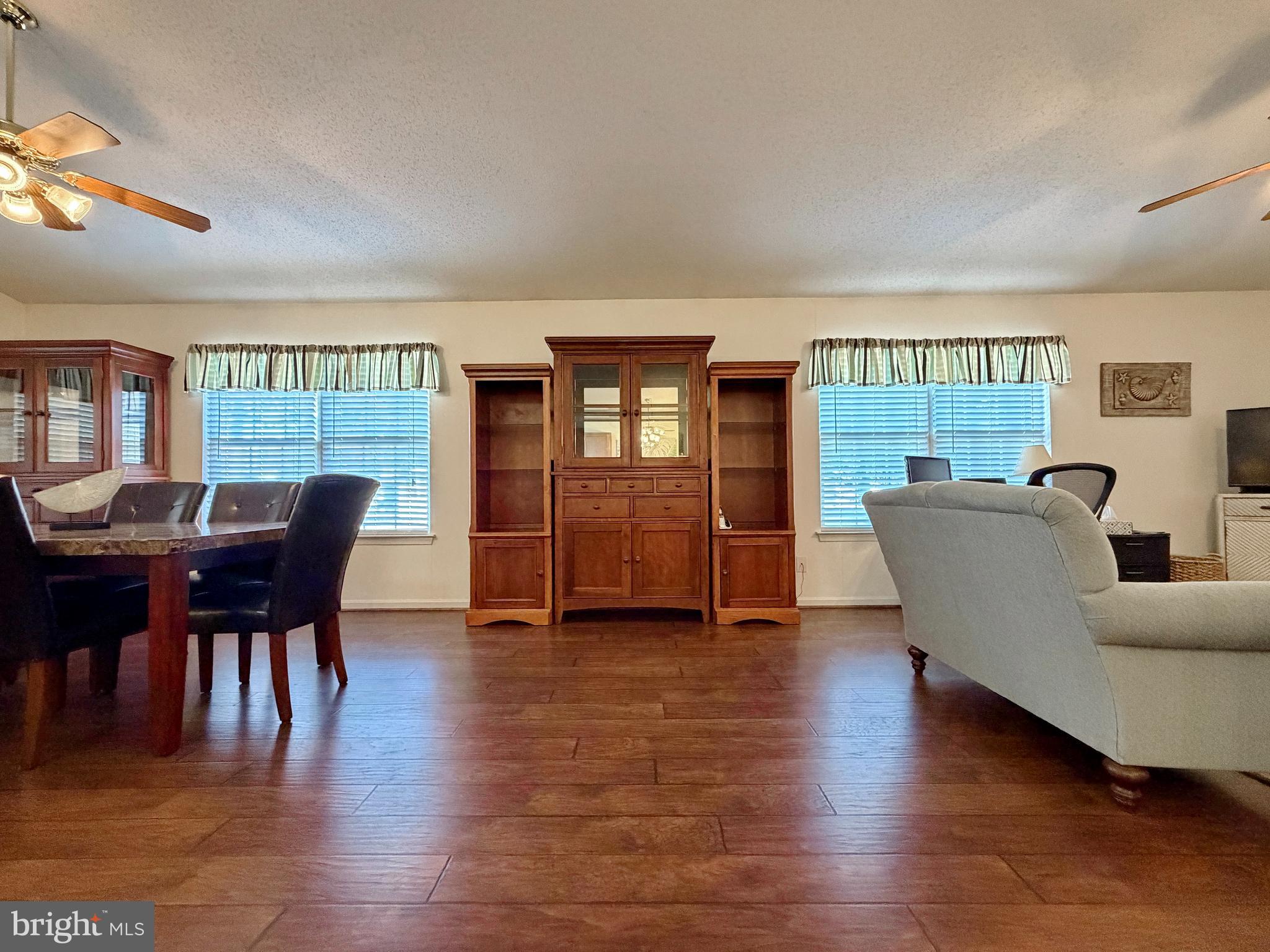 17466 Audrey Road Cobb Island, MD 20625 - Photo 32 of 59 a living room with furniture and a wooden floor