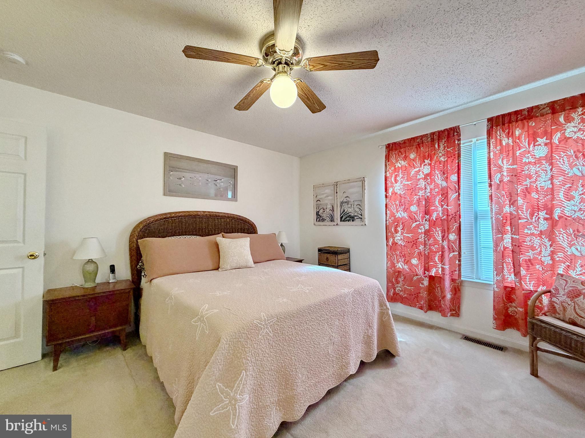 17466 Audrey Road Cobb Island, MD 20625 - Photo 35 of 59 a bedroom with a bed and a chandelier