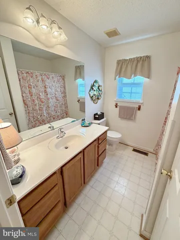 a bathroom with a shower curtain