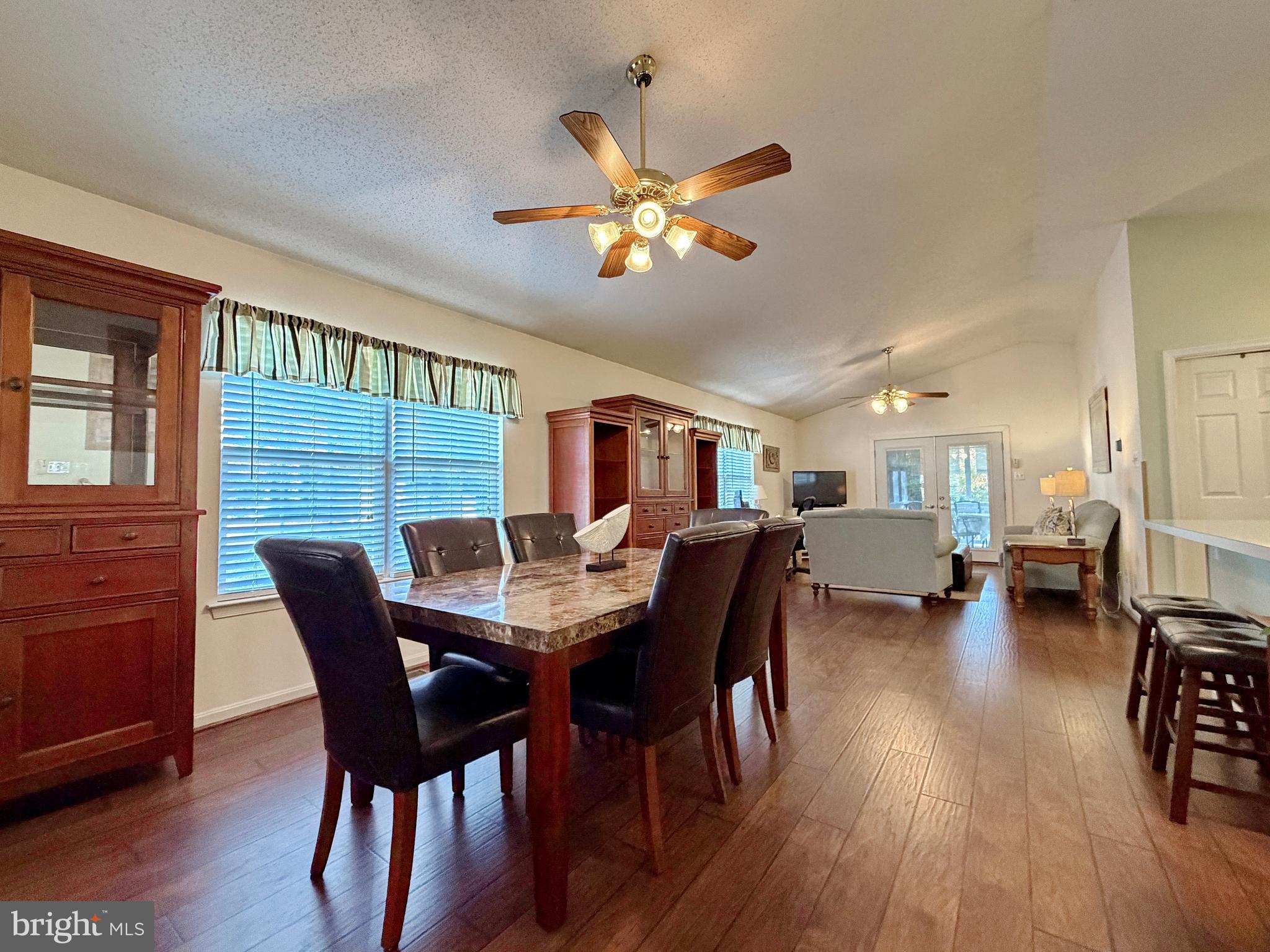 17466 Audrey Road Cobb Island, MD 20625 - Photo 4 of 59 a view of a dining room with furniture window and wooden floor