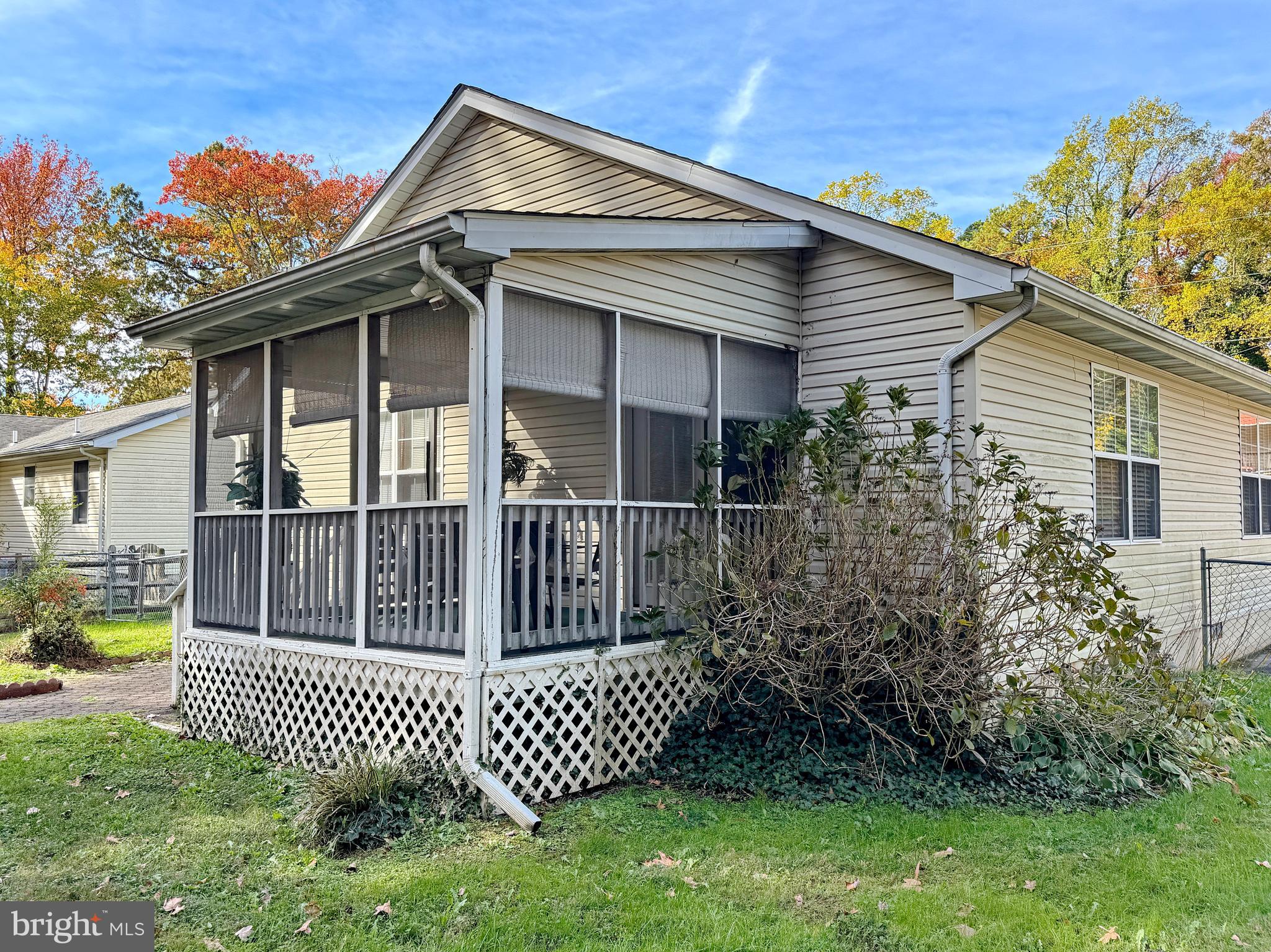 17466 Audrey Road Cobb Island, MD 20625 - Photo 52 of 59 a view of a house with a small yard and wooden fence
