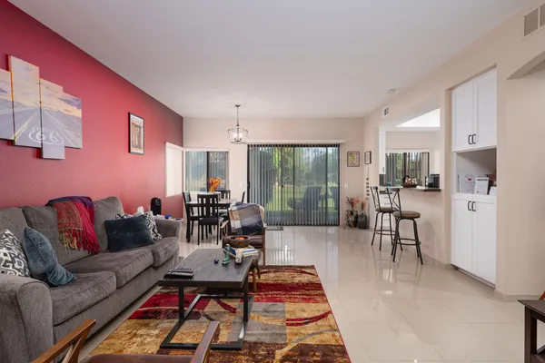 a living room with furniture and a large window