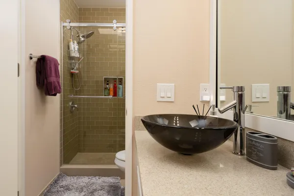 a bathroom with a tub and shower
