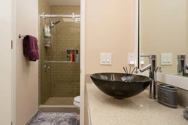 a bathroom with a tub and shower
