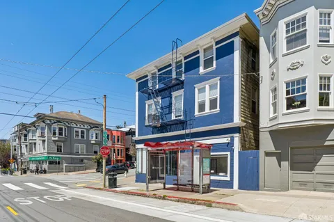a view of a building and a street