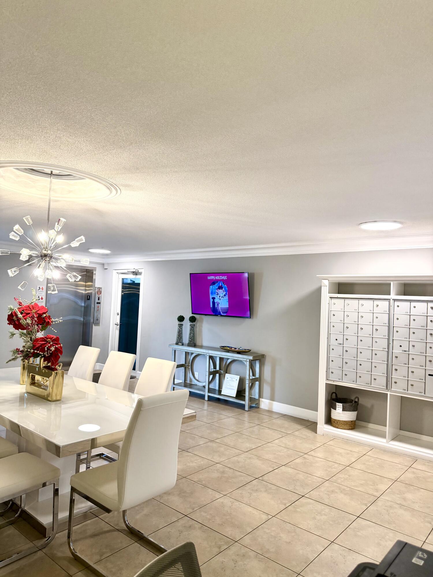 1439 South Ocean Boulevard, Unit 303 Lauderdale-by-the-Sea, FL 33062 - Photo 12 of 31 a living room with furniture and a table