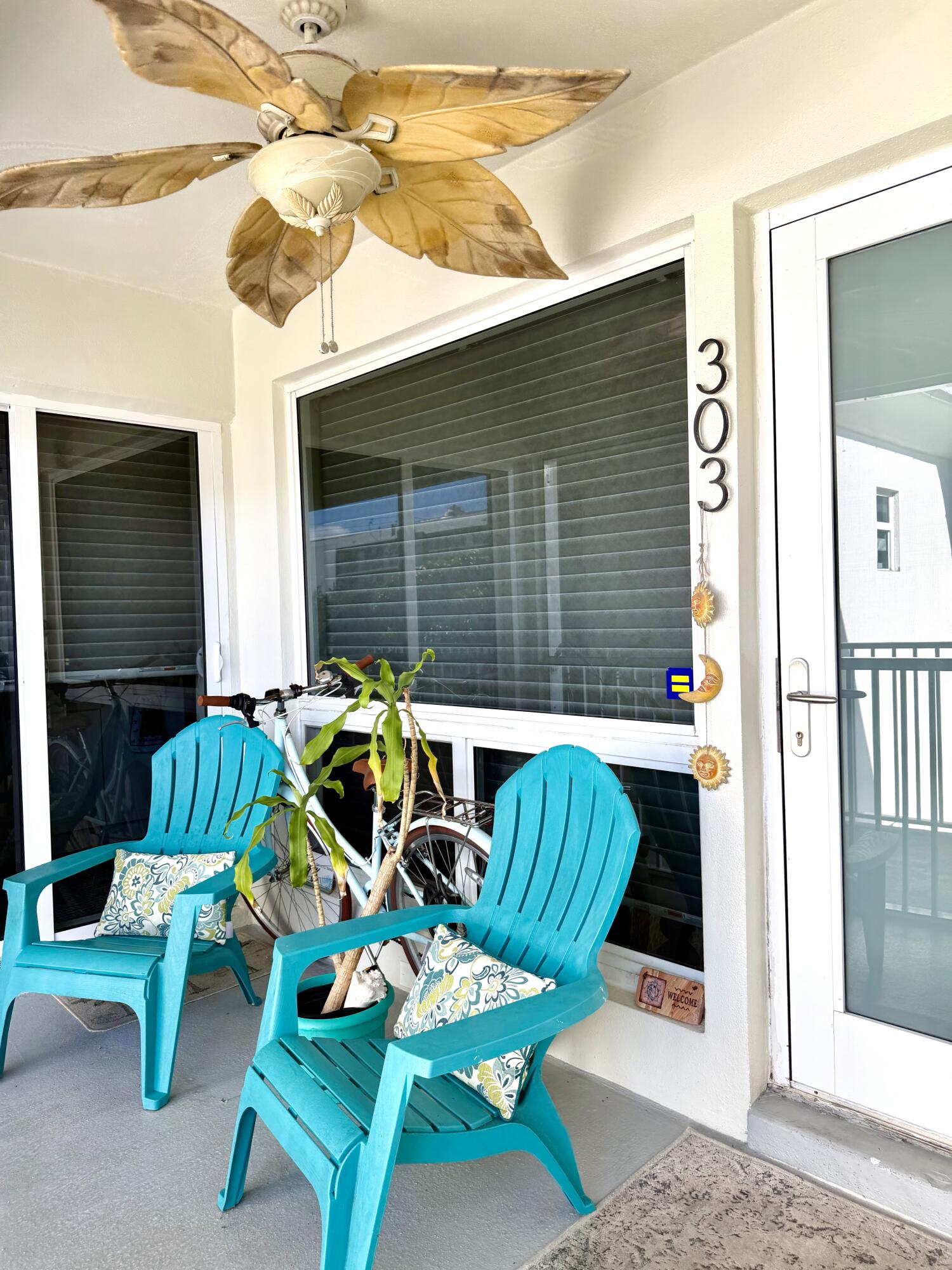 1439 South Ocean Boulevard, Unit 303 Lauderdale-by-the-Sea, FL 33062 - Photo 14 of 31 a front view of a house with patio outdoor seating