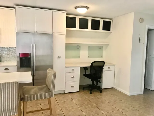 a view of a hallway with a dining area