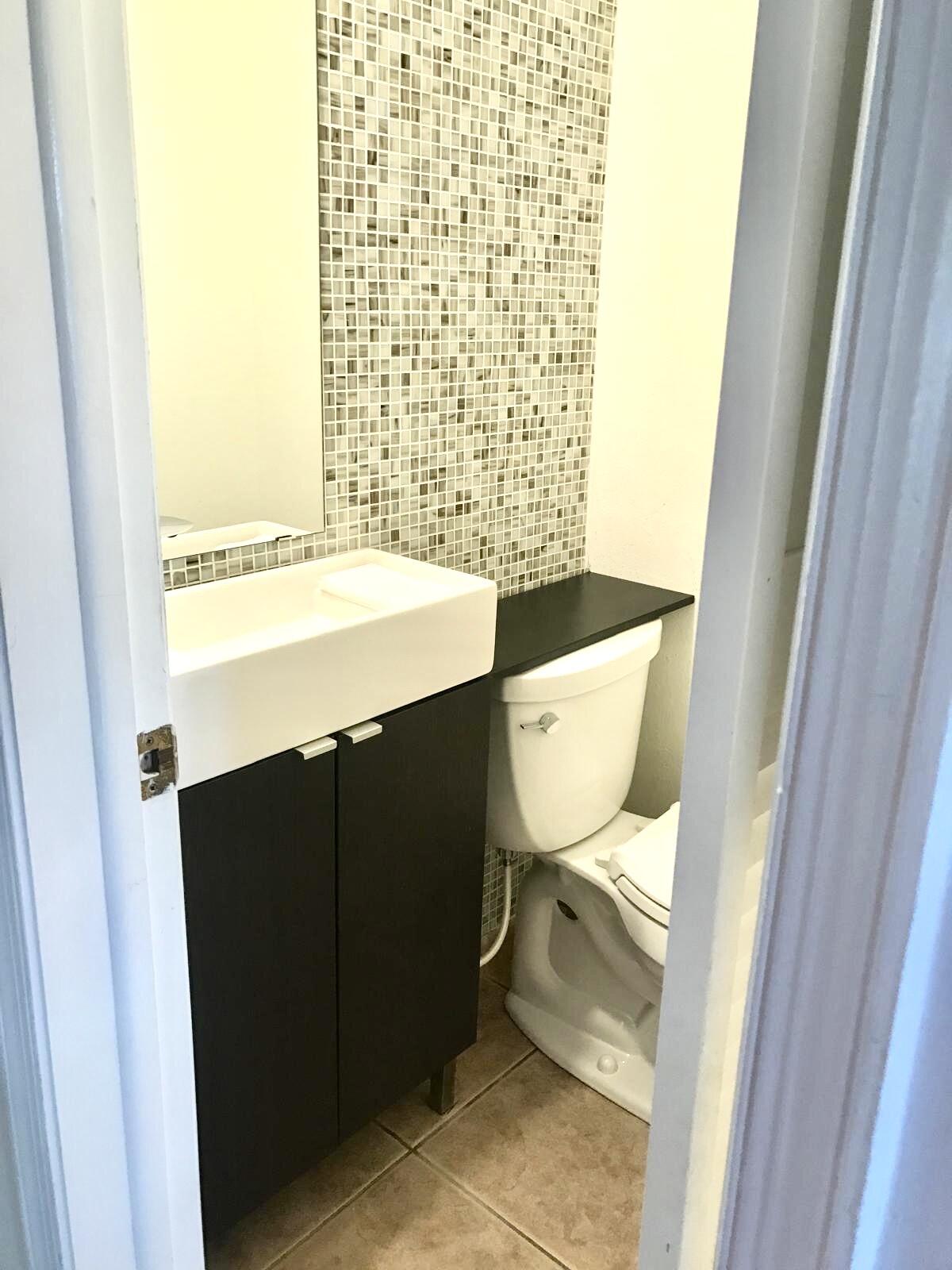 1439 South Ocean Boulevard, Unit 303 Lauderdale-by-the-Sea, FL 33062 - Photo 20 of 31 a bathroom with a sink and a toilet