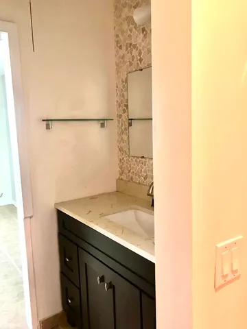 a sign board on the side of a street