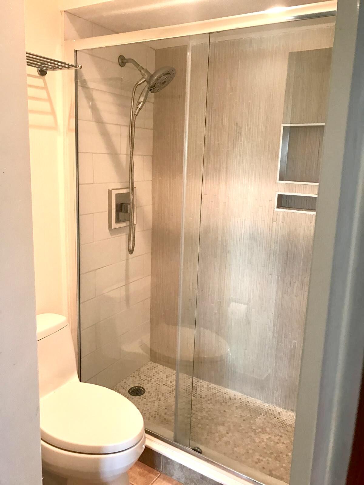 1439 South Ocean Boulevard, Unit 303 Lauderdale-by-the-Sea, FL 33062 - Photo 25 of 31 a white toilet sitting next to a bathroom sink