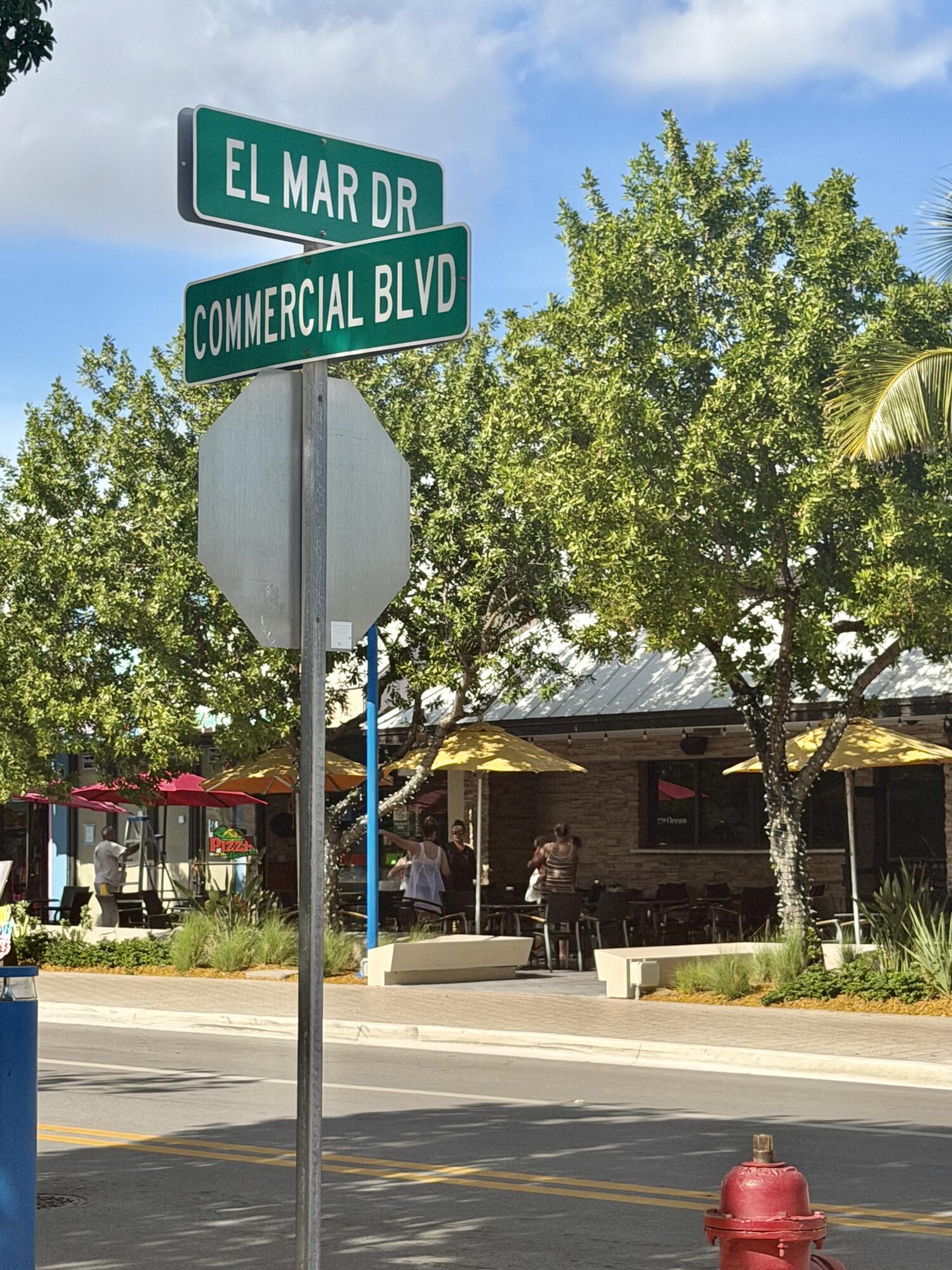 1439 South Ocean Boulevard, Unit 303 Lauderdale-by-the-Sea, FL 33062 - Photo 27 of 31 a sign board on the side of a street