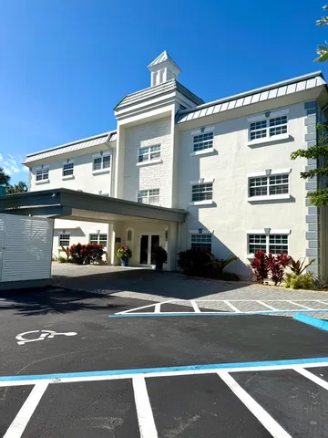 a view of a building and car parked