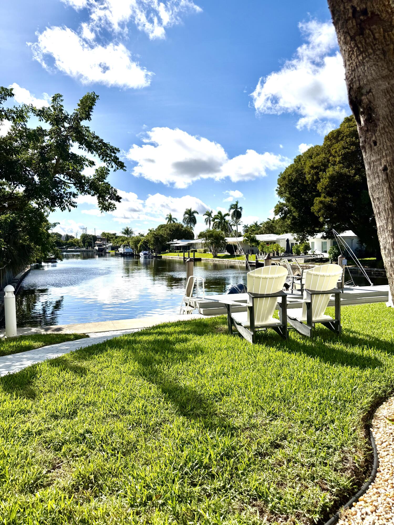 1439 South Ocean Boulevard, Unit 303 Lauderdale-by-the-Sea, FL 33062 - Photo 9 of 31 a view of a lake with houses in the back