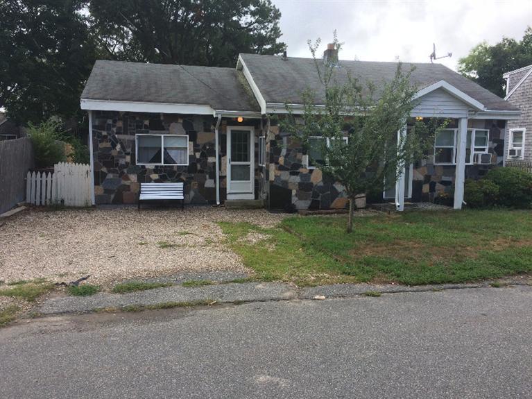138 Spring Street Hyannis, MA 02601 - Photo 7 of 12 a view of a house with a yard and sitting area