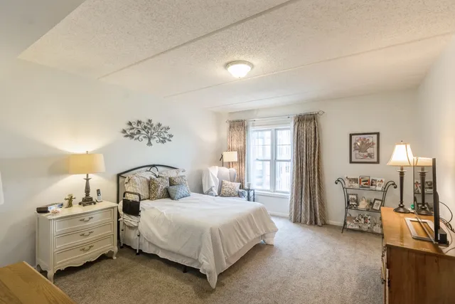 a bedroom with a bed and furniture