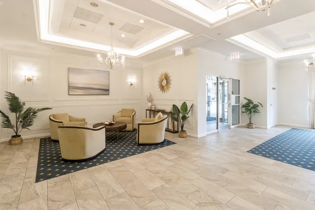 a room with furniture and view of living room