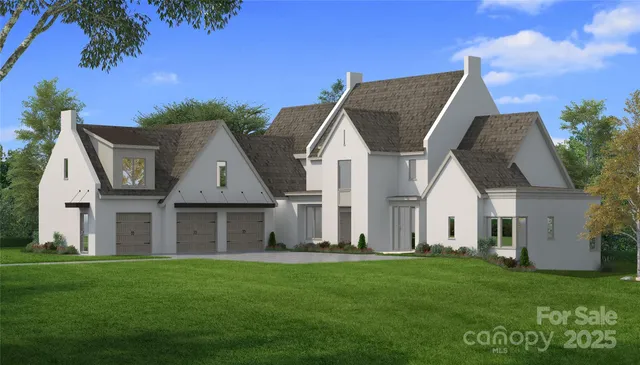 a front view of a house with a garden and yard