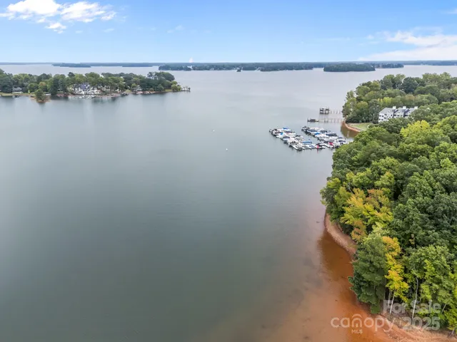 an aerial view of a houses with ocean view