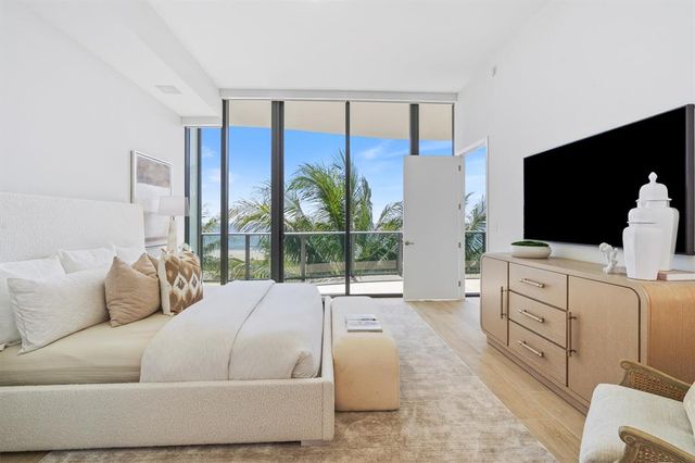a living room with furniture and flat screen tv