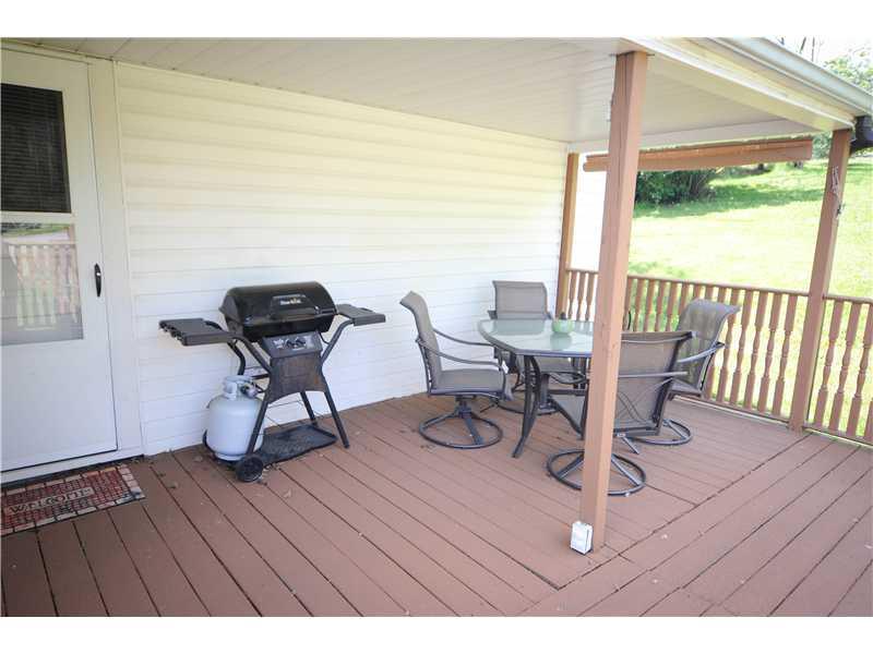 114 Lutes Road Venetia, PA 15367 - Photo 20 of 24 Patio/Deck. Refurbished deck offers privacy and shade.