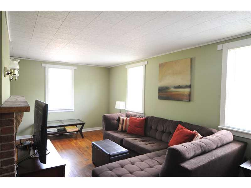114 Lutes Road Venetia, PA 15367 - Photo 8 of 24 Living Room. Awesome natural light fills the room and the fireplace lighting adds charm.