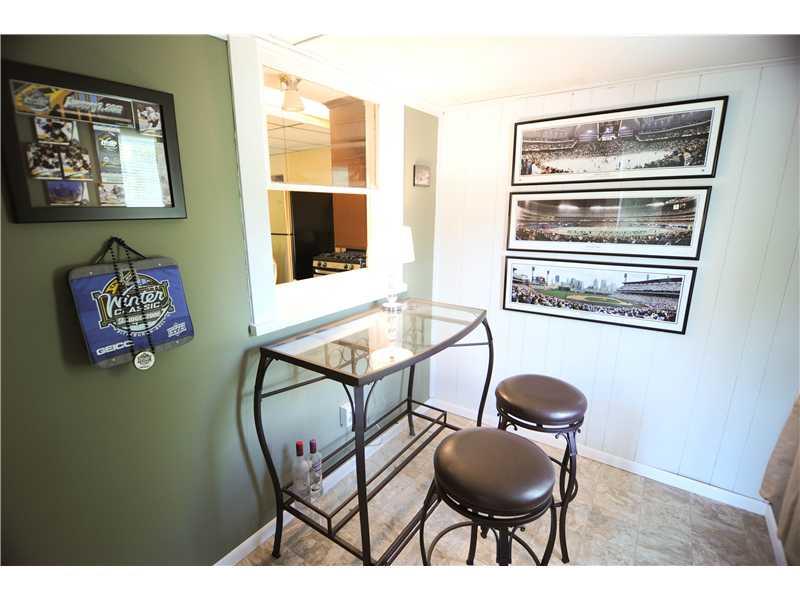 114 Lutes Road Venetia, PA 15367 - Photo 10 of 24 Den. A bonus room from the living room that is a perfect place to serve a drink.