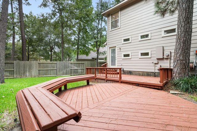 a backyard of a house with barbeque oven