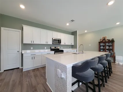 a bathroom with a double vanity sink and mirror