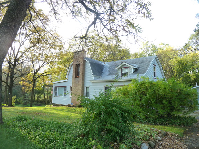 22968 West Grimm Road Antioch, IL 60002 - Photo 3 of 24 a front view of a house with garden
